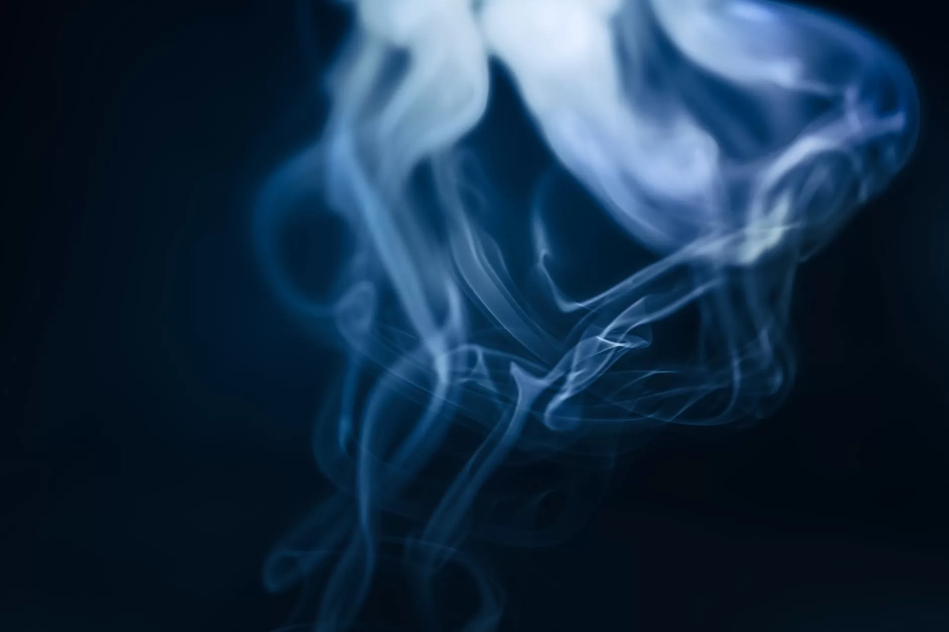 a smoke floating upwards in the air