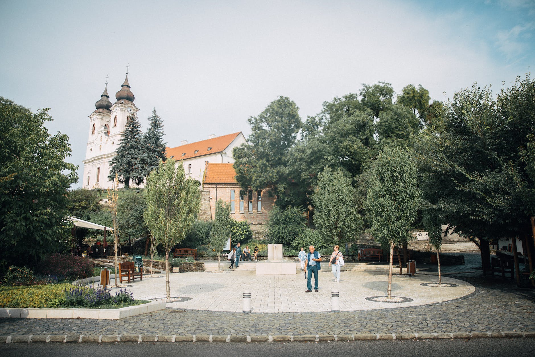 people walking in park square